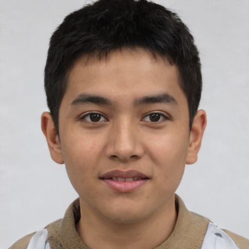 Joyful latino young-adult male with short  brown hair and brown eyes