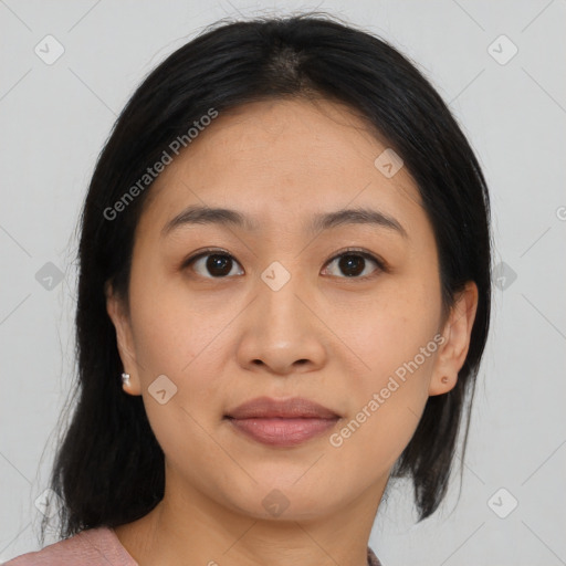 Joyful asian young-adult female with medium  black hair and brown eyes