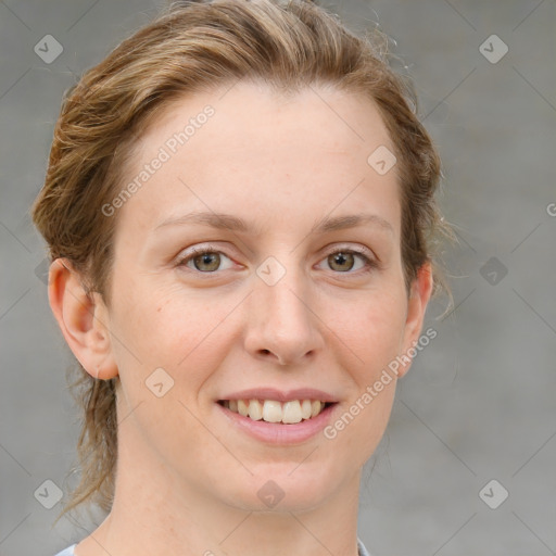 Joyful white young-adult female with medium  brown hair and green eyes