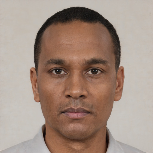 Neutral black adult male with short  black hair and brown eyes