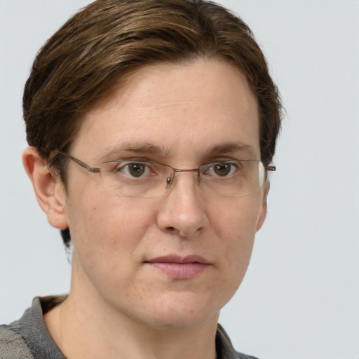 Joyful white adult male with short  brown hair and grey eyes