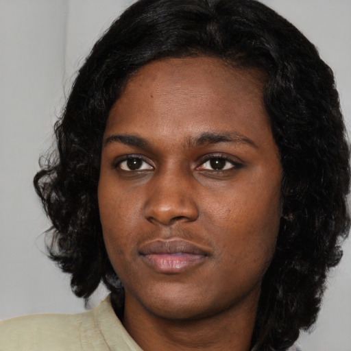 Neutral black young-adult female with medium  black hair and brown eyes