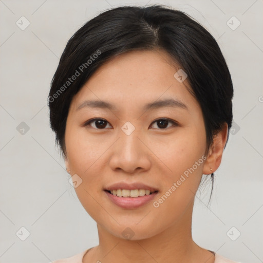 Joyful asian young-adult female with short  black hair and brown eyes