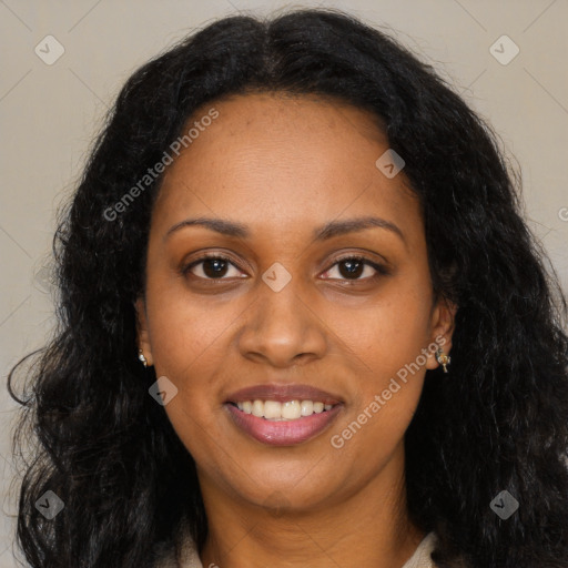 Joyful black adult female with long  brown hair and brown eyes