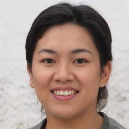 Joyful asian young-adult female with medium  brown hair and brown eyes