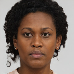 Neutral black young-adult female with short  brown hair and brown eyes