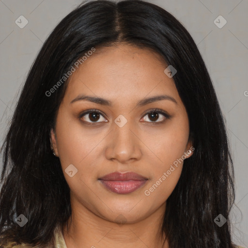 Joyful latino young-adult female with long  brown hair and brown eyes