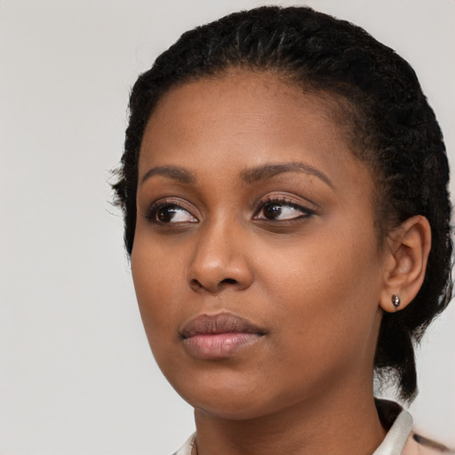 Neutral black young-adult female with medium  black hair and brown eyes