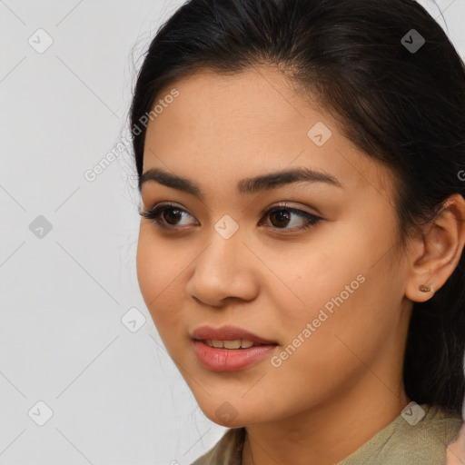 Joyful latino young-adult female with medium  brown hair and brown eyes