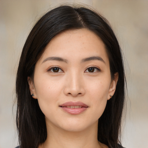 Joyful asian young-adult female with medium  brown hair and brown eyes