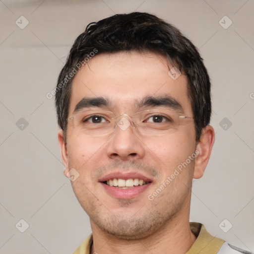 Joyful white young-adult male with short  black hair and brown eyes