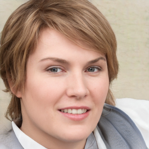 Joyful white young-adult female with short  brown hair and grey eyes