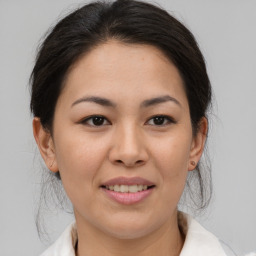 Joyful asian young-adult female with medium  brown hair and brown eyes