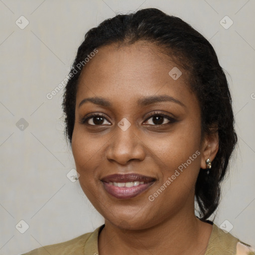 Joyful black young-adult female with medium  black hair and brown eyes