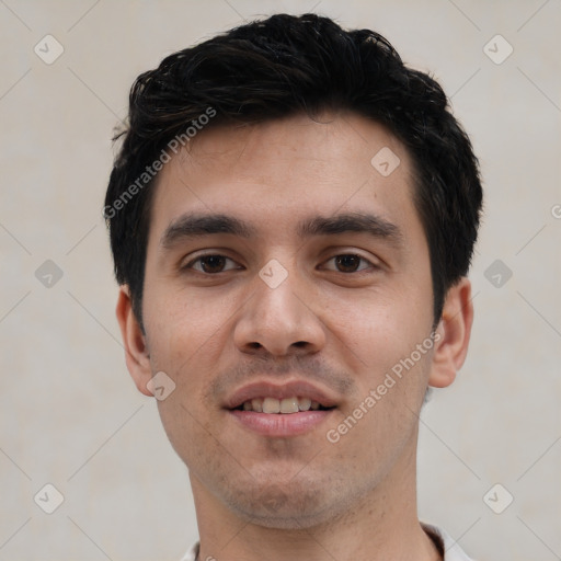 Joyful white young-adult male with short  black hair and brown eyes