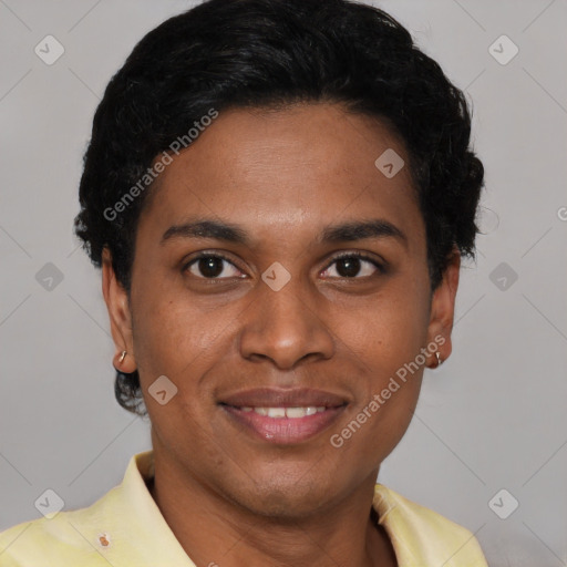 Joyful latino young-adult male with short  brown hair and brown eyes