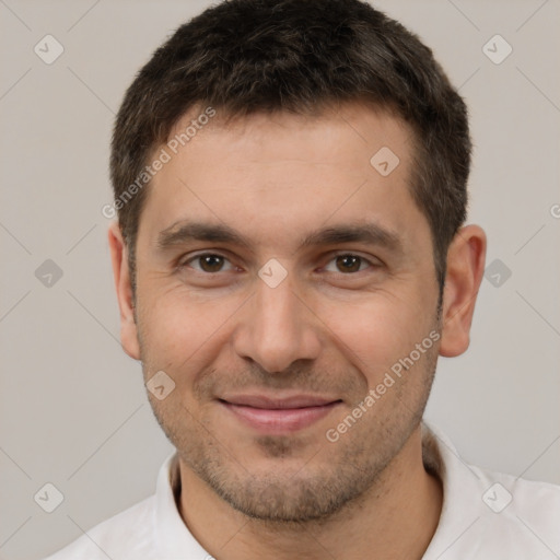 Joyful white young-adult male with short  brown hair and brown eyes