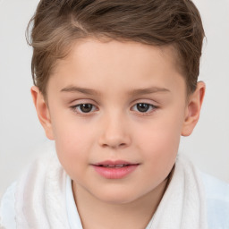 Joyful white child male with short  brown hair and brown eyes