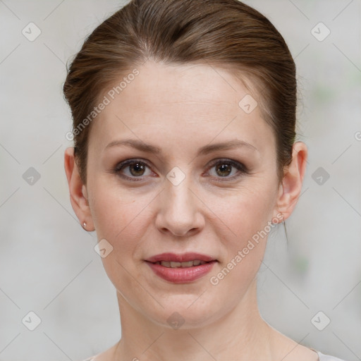 Joyful white adult female with short  brown hair and grey eyes