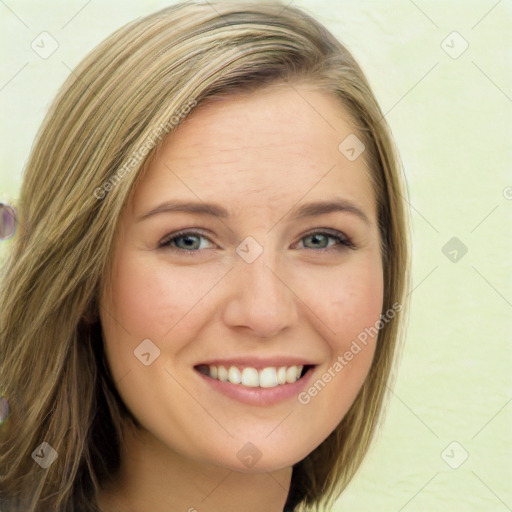 Joyful white young-adult female with long  brown hair and green eyes