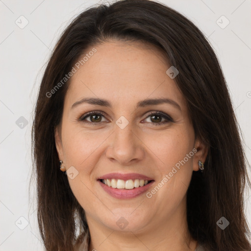 Joyful white young-adult female with long  brown hair and brown eyes