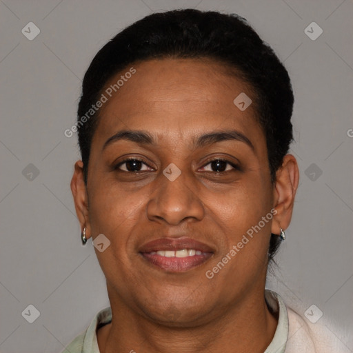 Joyful black adult female with short  brown hair and brown eyes