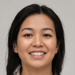 Joyful asian young-adult female with medium  brown hair and brown eyes