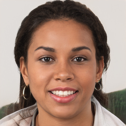 Joyful white young-adult female with medium  brown hair and brown eyes