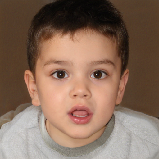 Joyful white child male with short  brown hair and brown eyes