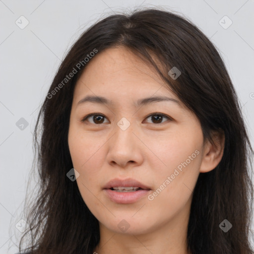 Joyful asian young-adult female with long  brown hair and brown eyes