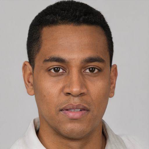 Neutral latino young-adult male with short  brown hair and brown eyes
