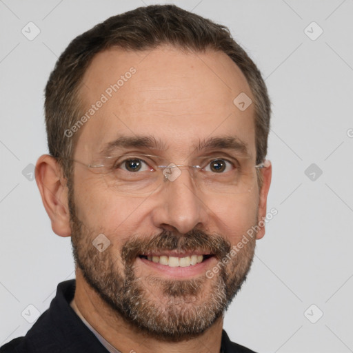 Joyful white adult male with short  brown hair and brown eyes