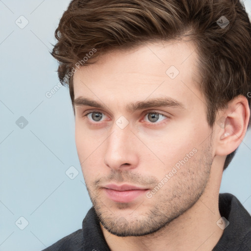 Neutral white young-adult male with short  brown hair and grey eyes