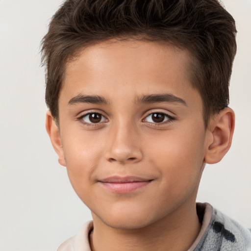 Joyful white child male with short  brown hair and brown eyes