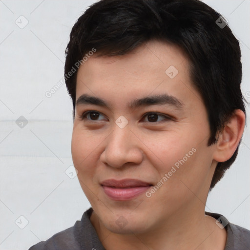 Joyful asian young-adult male with short  brown hair and brown eyes