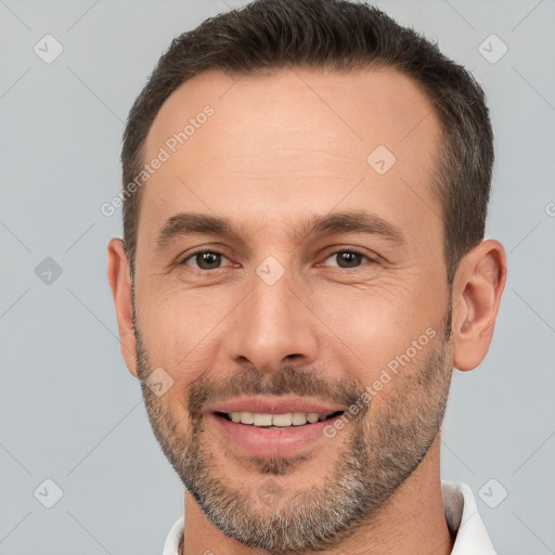 Joyful white adult male with short  brown hair and brown eyes