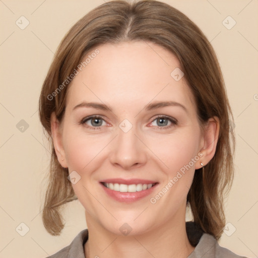 Joyful white young-adult female with medium  brown hair and grey eyes