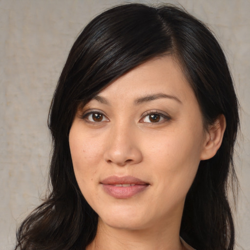 Joyful white young-adult female with medium  black hair and brown eyes