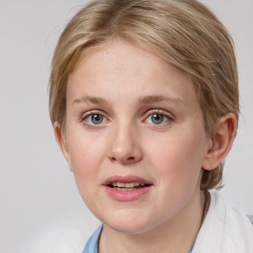 Joyful white young-adult female with medium  brown hair and blue eyes