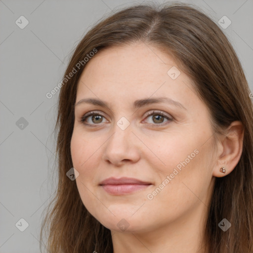 Joyful white adult female with long  brown hair and brown eyes