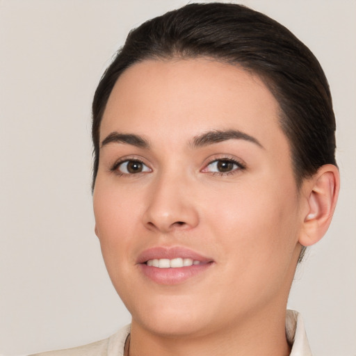 Joyful white young-adult female with short  brown hair and brown eyes