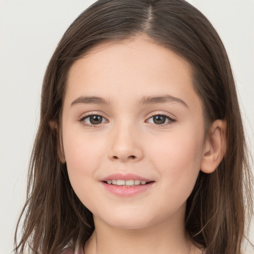 Joyful white child female with long  brown hair and brown eyes