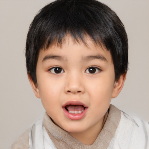 Joyful asian child male with short  brown hair and brown eyes