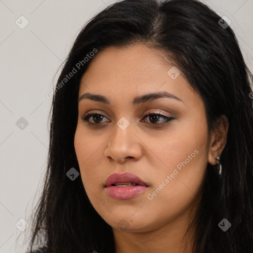 Joyful latino young-adult female with long  brown hair and brown eyes