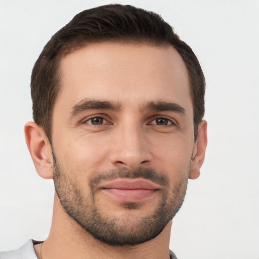 Joyful white young-adult male with short  brown hair and brown eyes