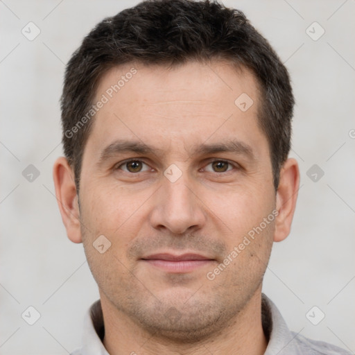 Joyful white adult male with short  brown hair and brown eyes