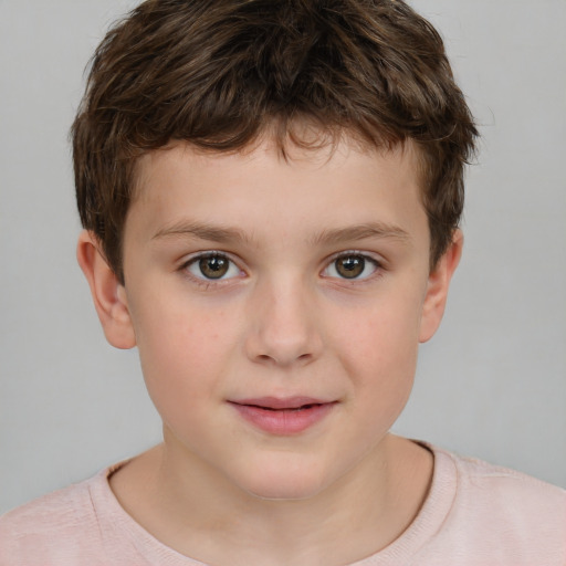 Joyful white child male with short  brown hair and brown eyes