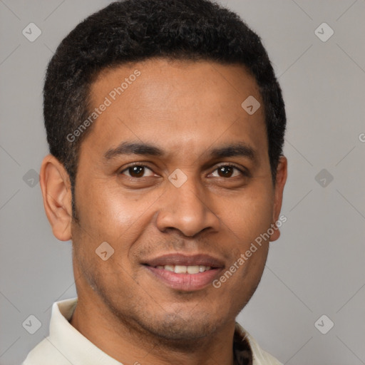 Joyful latino young-adult male with short  brown hair and brown eyes