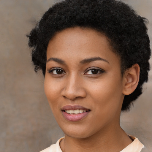 Joyful latino young-adult female with short  black hair and brown eyes