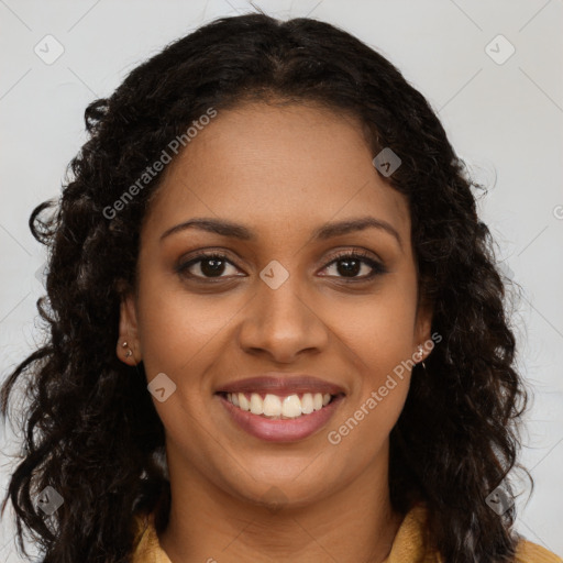 Joyful black young-adult female with long  brown hair and brown eyes